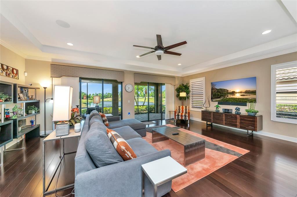 12848 Del Corso Loop Lakewood Ranch, FL 34211 - Photo 7 of 70 a living room with furniture and a flat screen tv