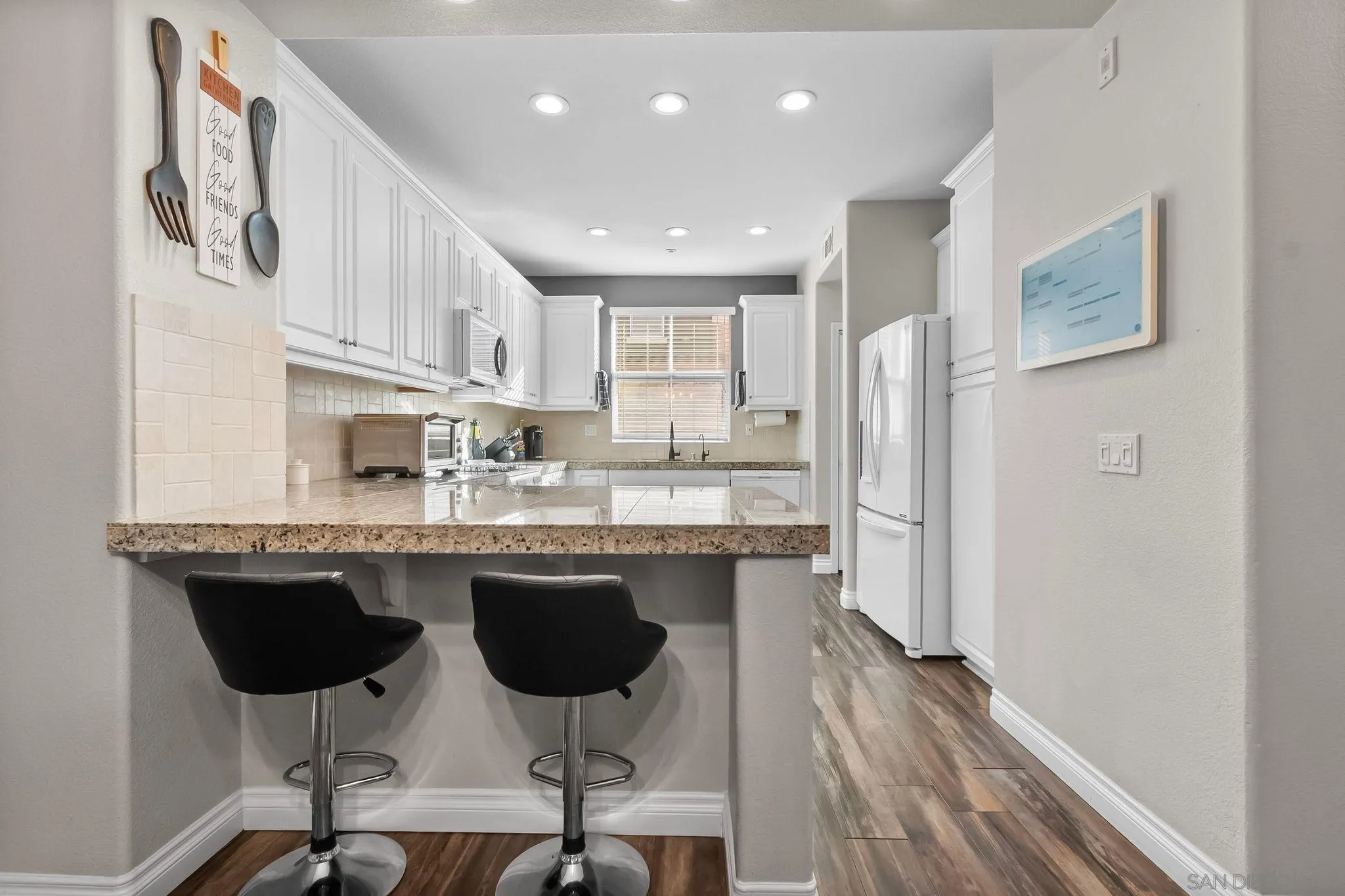 10240 Daybreak Lane, Unit 2 Santee, CA 92071 - Photo 15 of 48 a kitchen with stainless steel appliances granite countertop a sink and a refrigerator