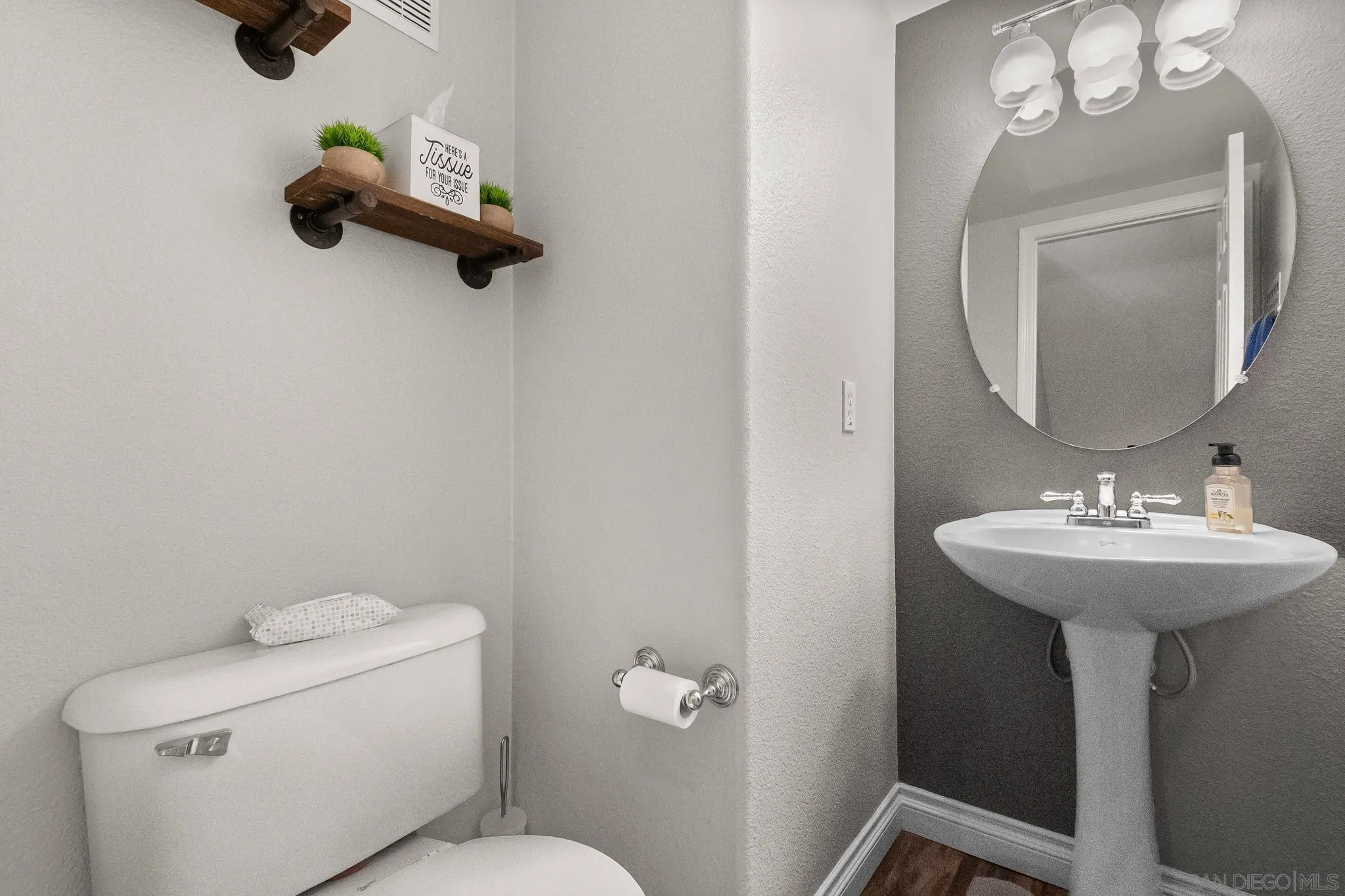 10240 Daybreak Lane, Unit 2 Santee, CA 92071 - Photo 19 of 48 a bathroom with a toilet a sink and mirror