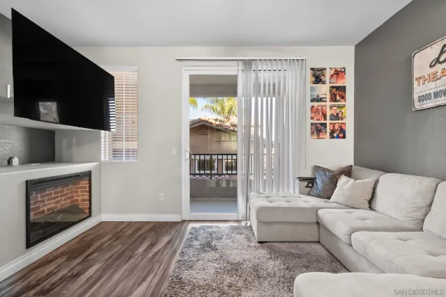 a living room with furniture and a rug