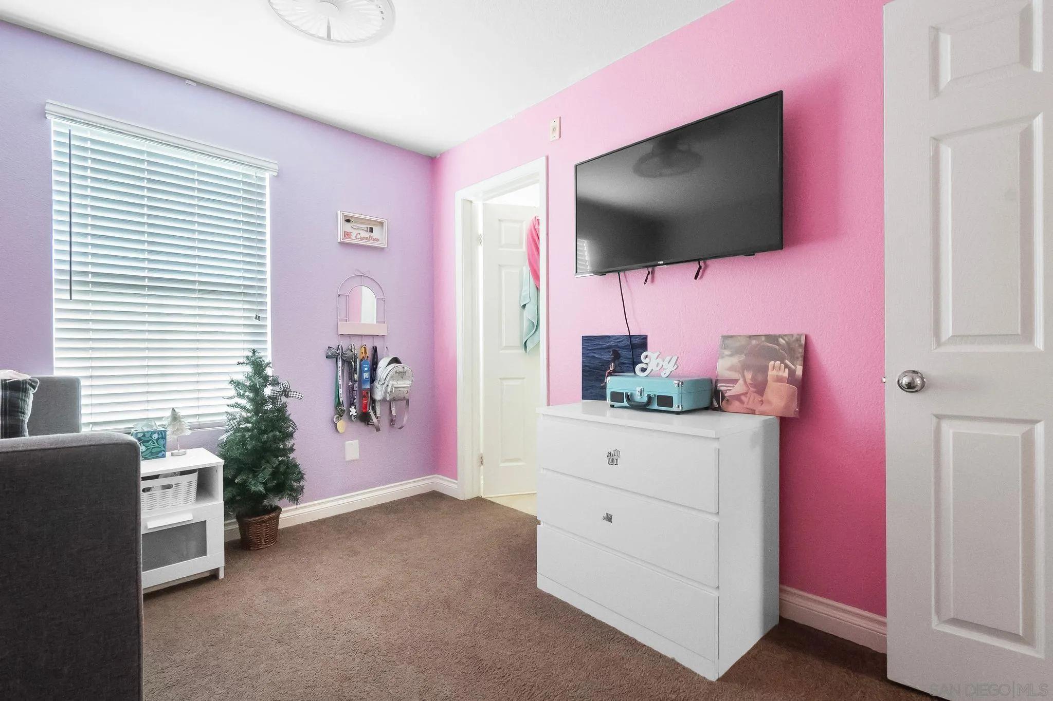 10240 Daybreak Lane, Unit 2 Santee, CA 92071 - Photo 33 of 48 a living room with furniture and a flat screen tv