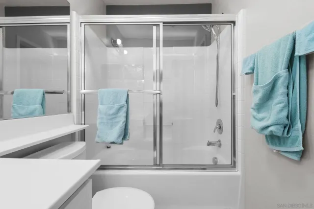 a room with a bed and a chandelier