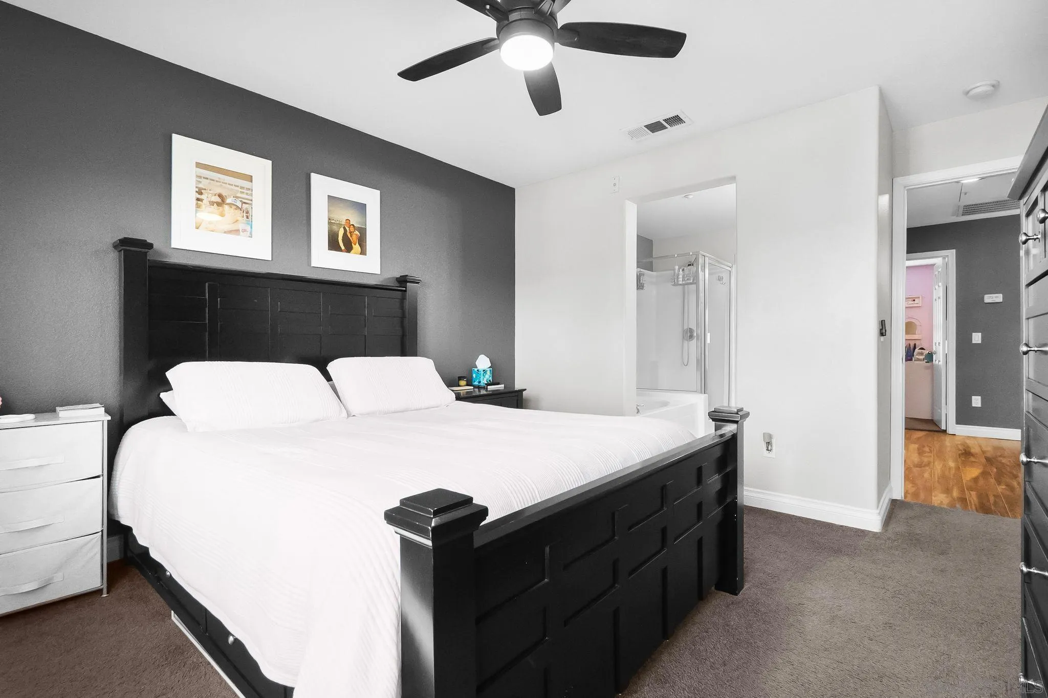 10240 Daybreak Lane, Unit 2 Santee, CA 92071 - Photo 37 of 48 a room with a bed and a chandelier