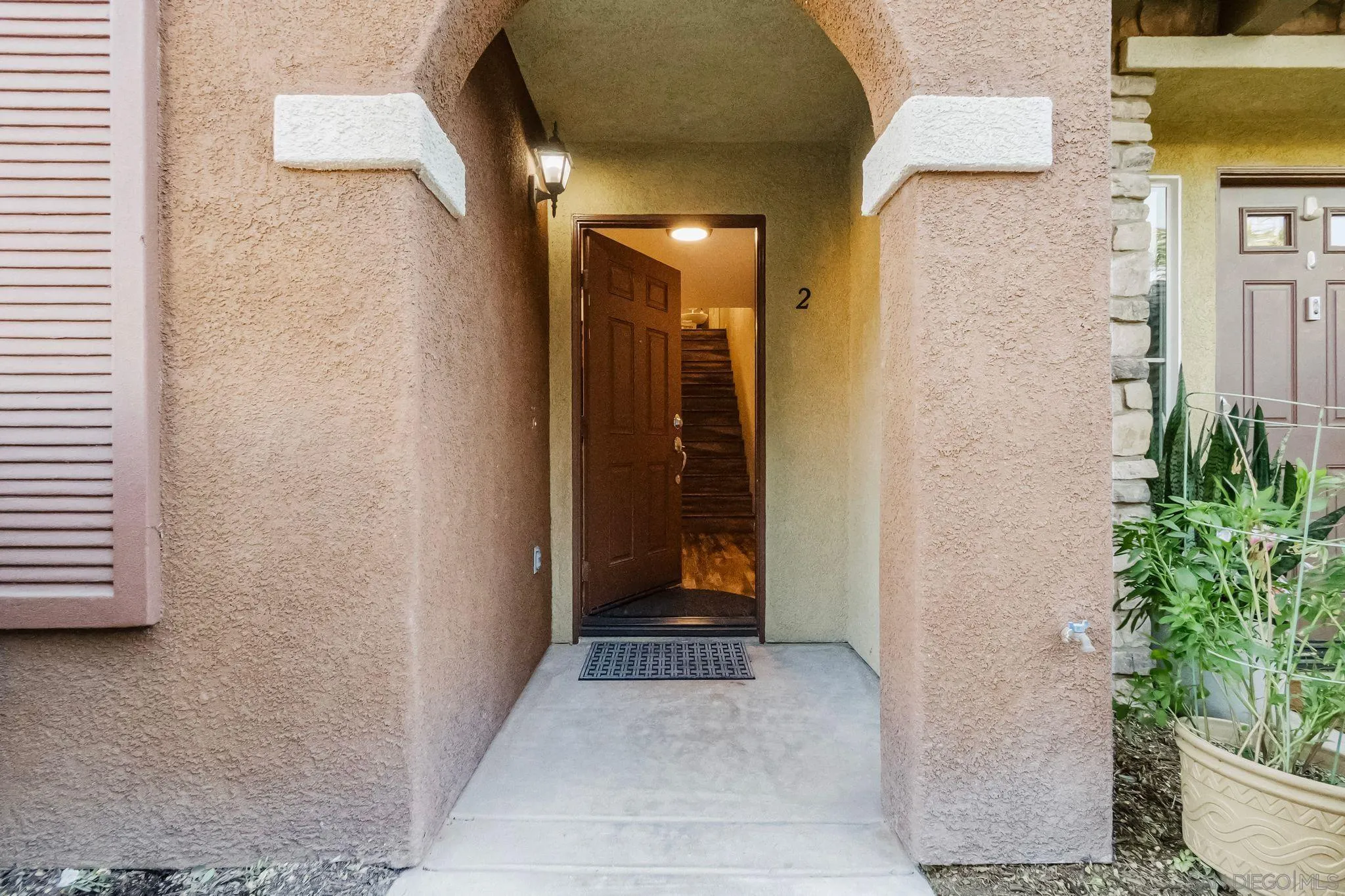 10240 Daybreak Lane, Unit 2 Santee, CA 92071 - Photo 4 of 48 a view of a hallway with wooden walls