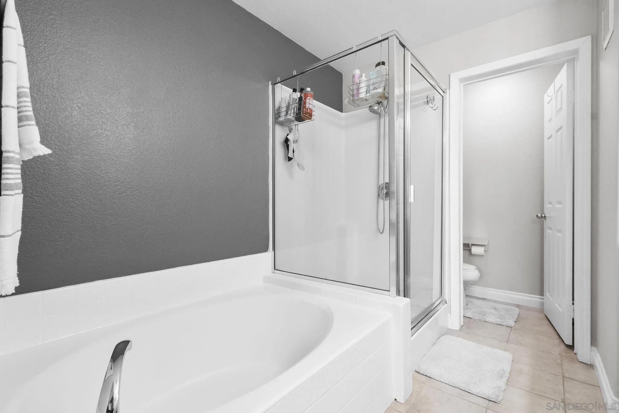 10240 Daybreak Lane, Unit 2 Santee, CA 92071 - Photo 44 of 48 a bathroom with a bathtub and a shower