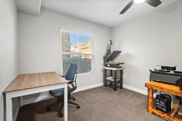 a bathroom with a granite countertop bathtub shower sink vanity and toilet