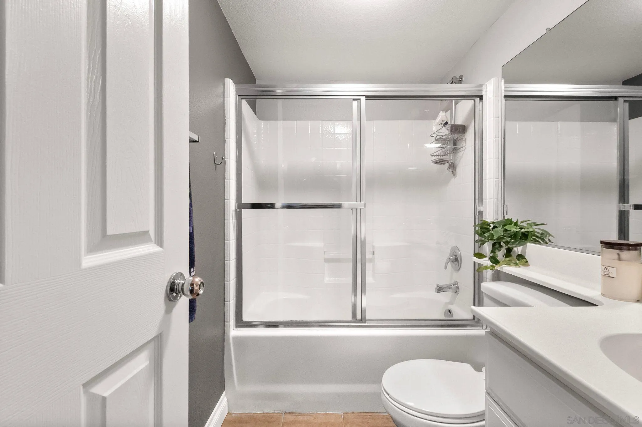 10240 Daybreak Lane, Unit 2 Santee, CA 92071 - Photo 9 of 48 a bathroom with a granite countertop bathtub shower sink vanity and toilet