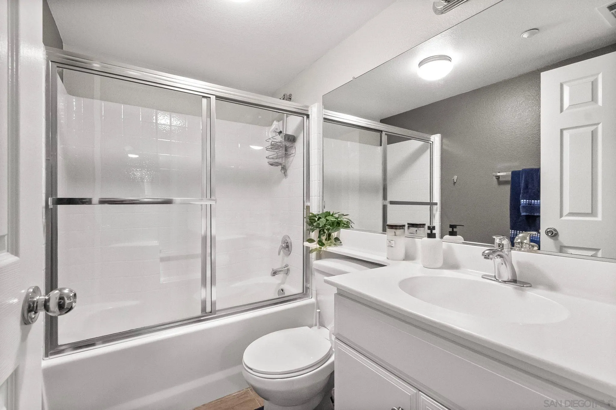 10240 Daybreak Lane, Unit 2 Santee, CA 92071 - Photo 10 of 48 a bathroom with a sink a toilet and shower