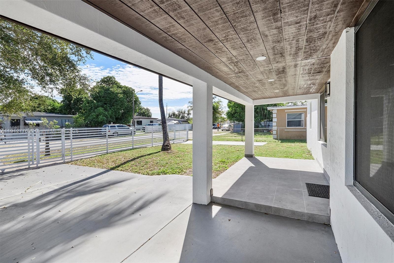 11730 Northwest 3rd Avenue Miami, FL 33168 - Photo 7 of 22 a view of swimming pool with yard