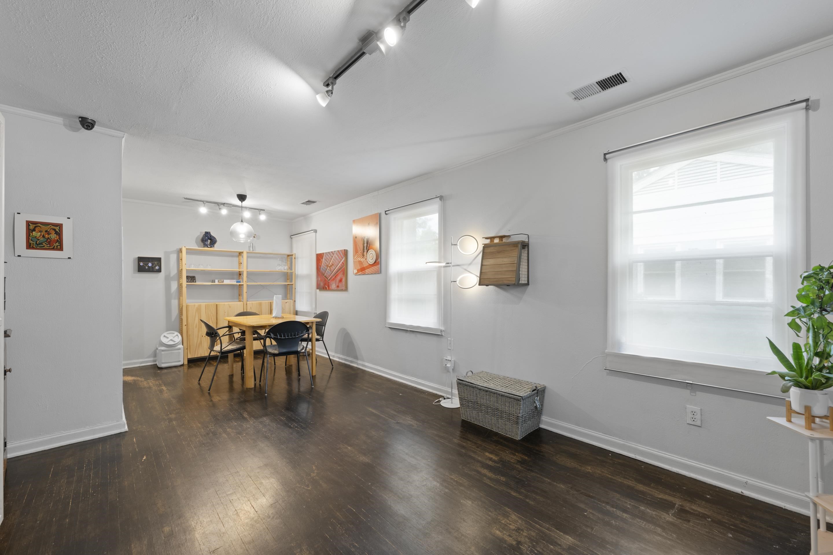 1343 Dearing Road Memphis, TN 38117 - Photo 4 of 19 Interior space featuring dark wood-finish flooring, white trim, and multiple windows