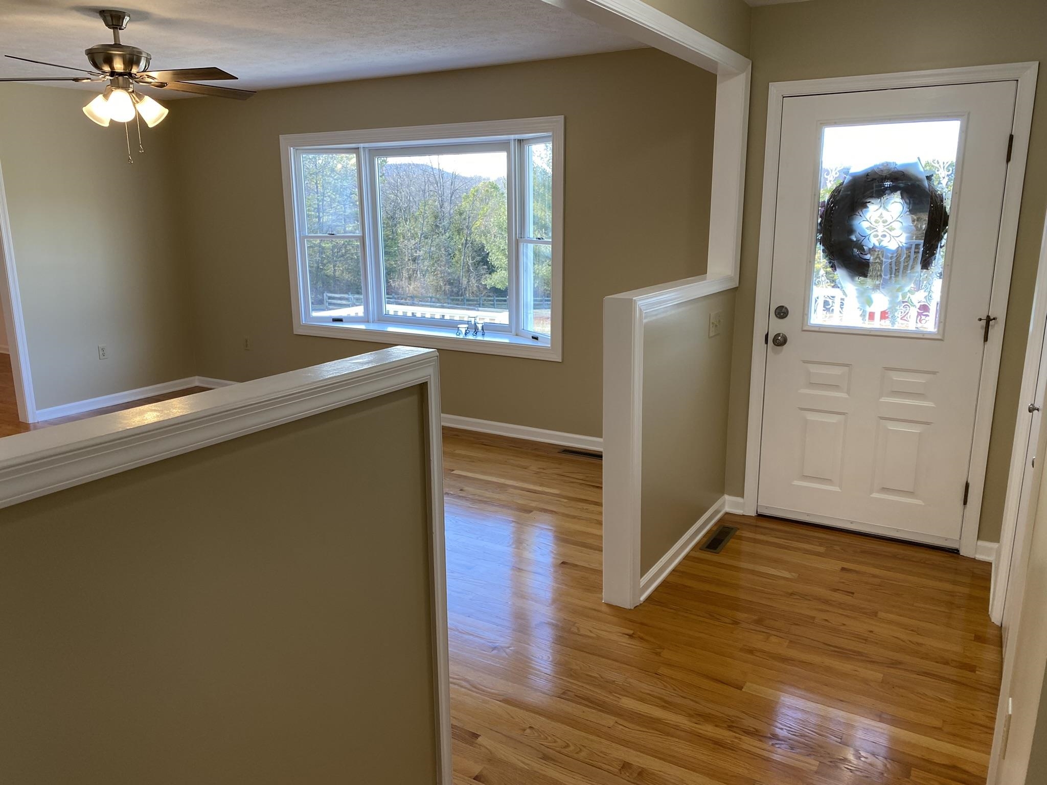 611 Stover Shop Road Churchville, VA 24421 - Photo 15 of 71 a view of empty room with wooden floor and fan