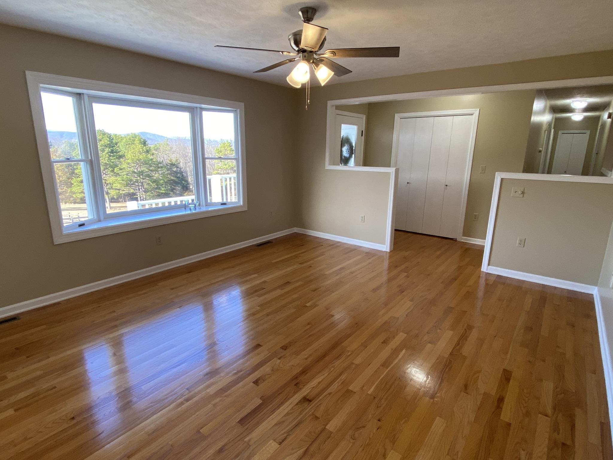 611 Stover Shop Road Churchville, VA 24421 - Photo 17 of 71 a view of an empty room with window and wooden floor
