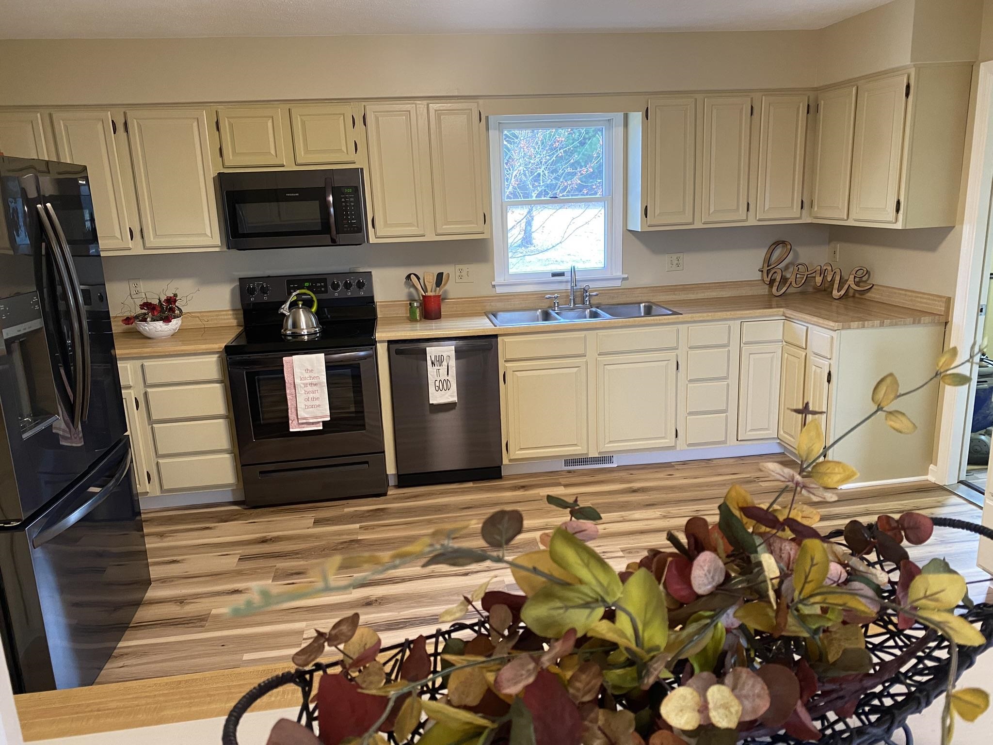 611 Stover Shop Road Churchville, VA 24421 - Photo 23 of 71 a kitchen with stainless steel appliances a stove a sink and a microwave