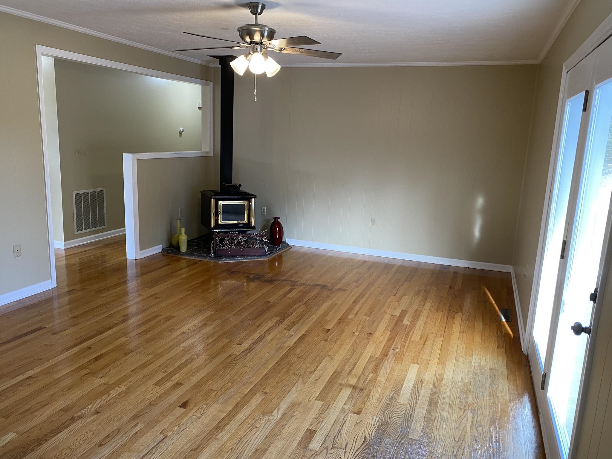 611 Stover Shop Road Churchville, VA 24421 - Photo 33 of 71 a view of a room with wooden floor ceiling fan and window