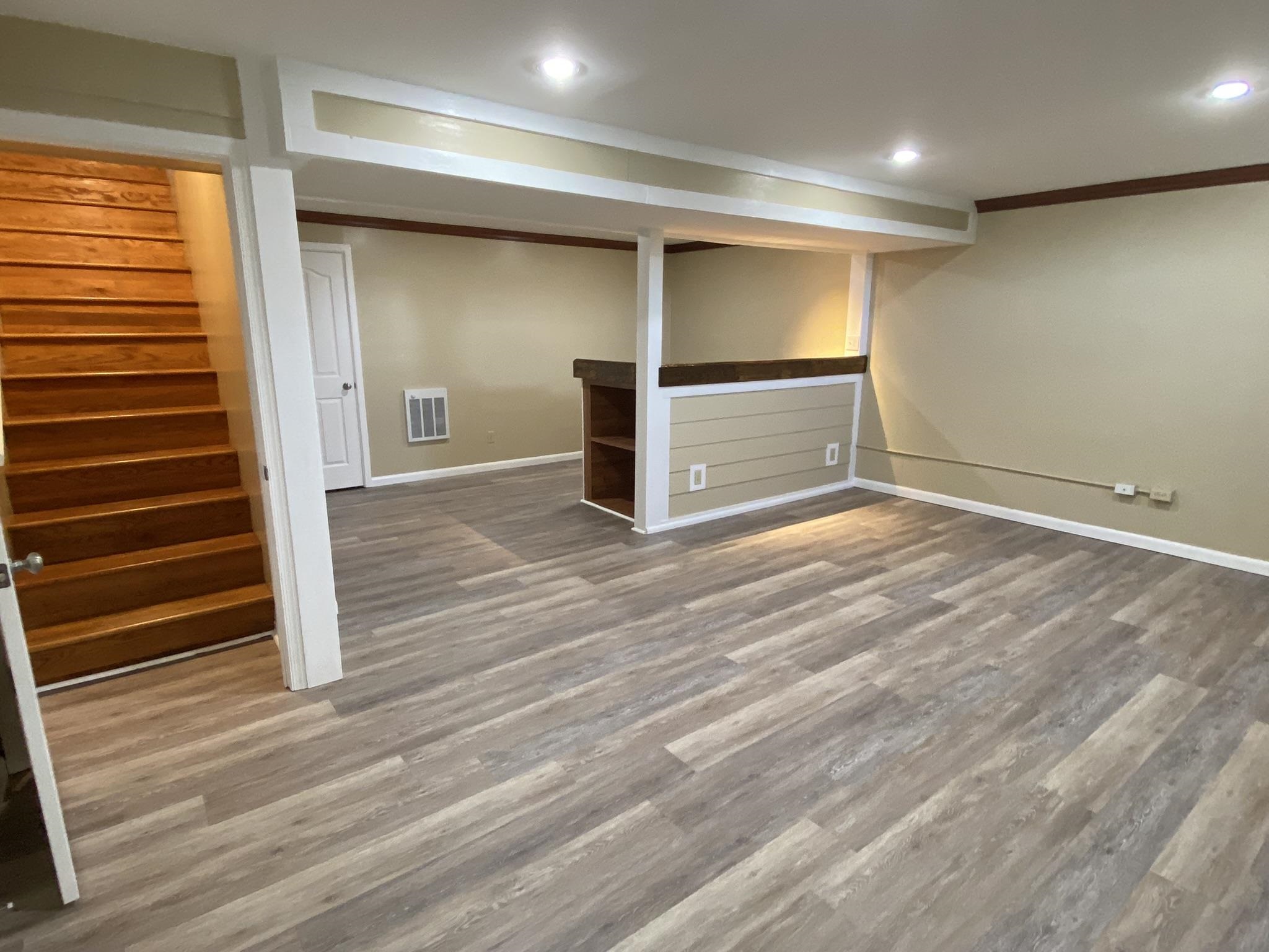 611 Stover Shop Road Churchville, VA 24421 - Photo 44 of 71 en empty room with wooden floor and windows