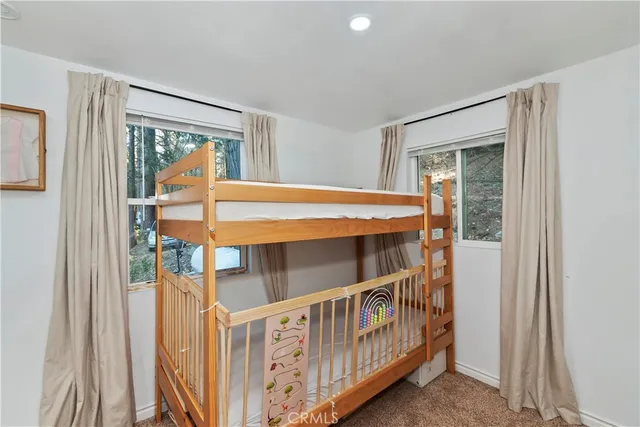 a bedroom with windows