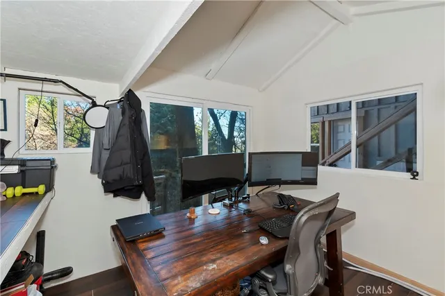 a view of a workspace with furniture