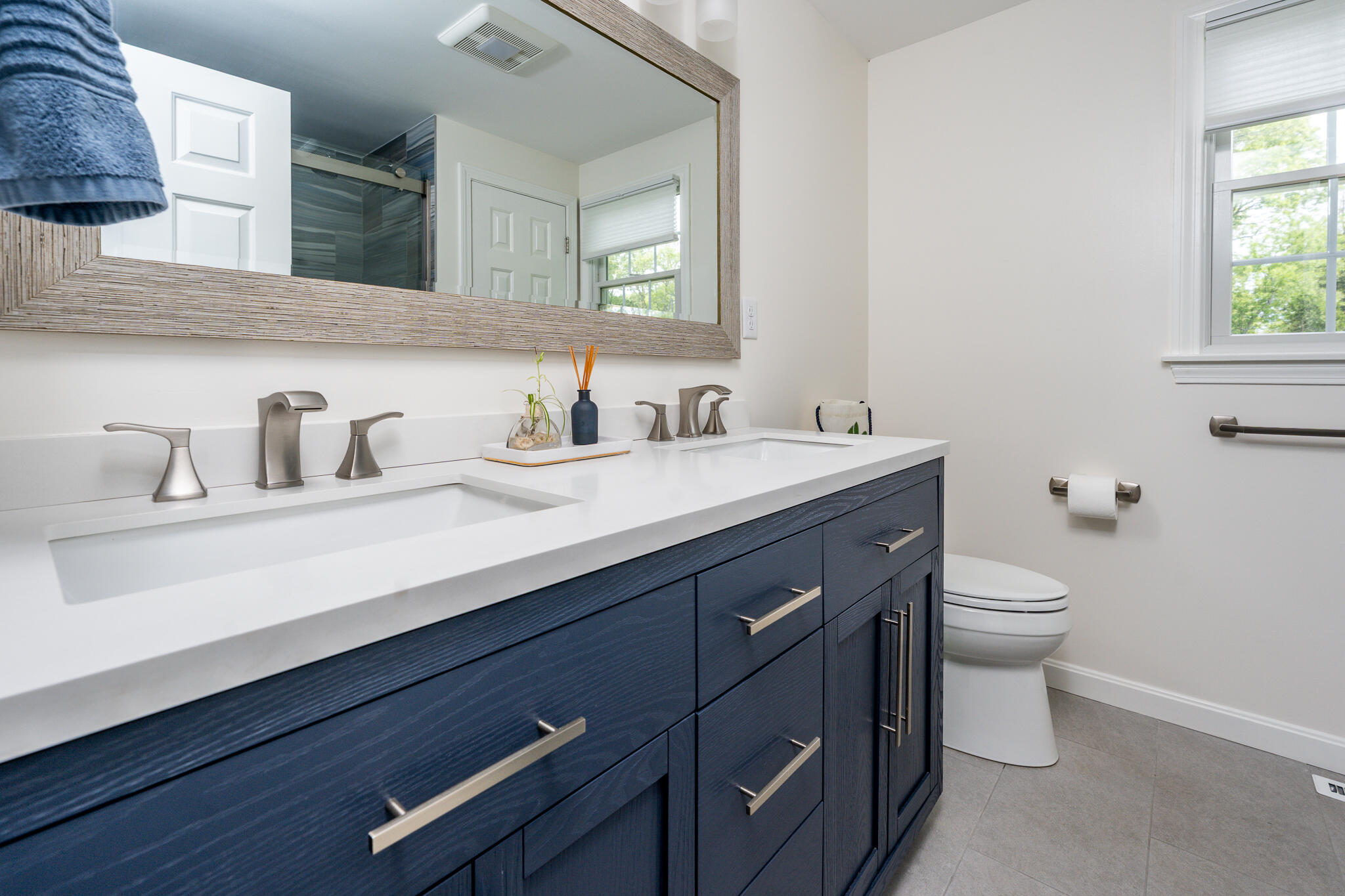 61 Angus Way Centerville, MA 02632 - Photo 20 of 59 a bathroom with a double vanity sink and a toilet