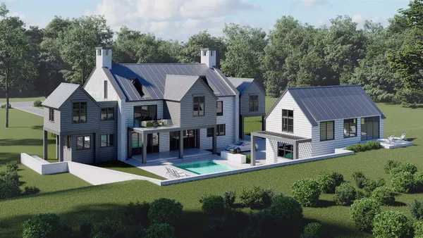 a aerial view of a house with swimming pool next to a yard