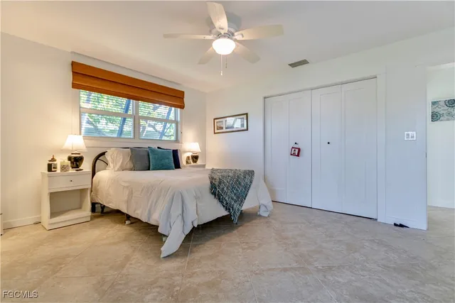 a bed room with a bed and a chandelier