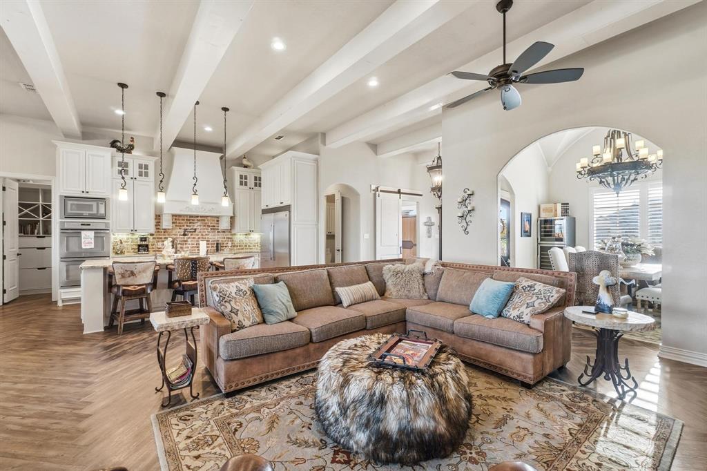 249 Rising Star Drive Abilene, TX 79606 - Photo 6 of 40 a living room with furniture and a chandelier