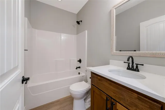 a bathroom with a sink a toilet and a bathtub
