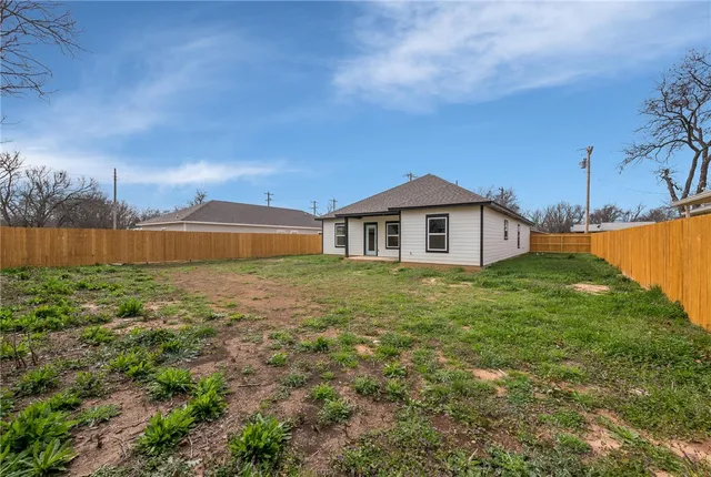 a backyard of a house with lots of green space