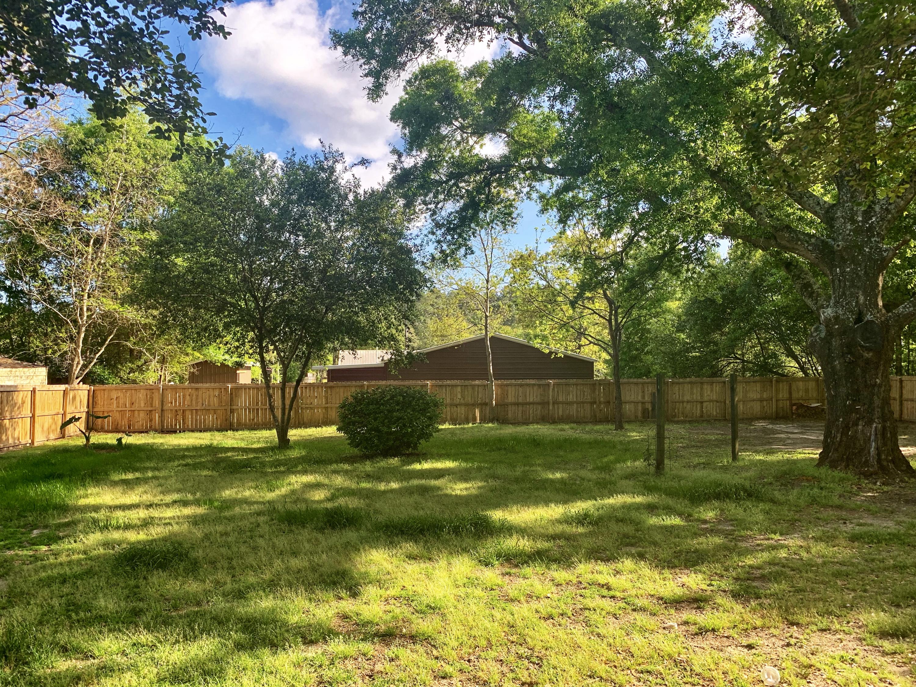 3088 Butler Road North Crestview, FL 32539 - Photo 2 of 6 a view of a tree in a yard