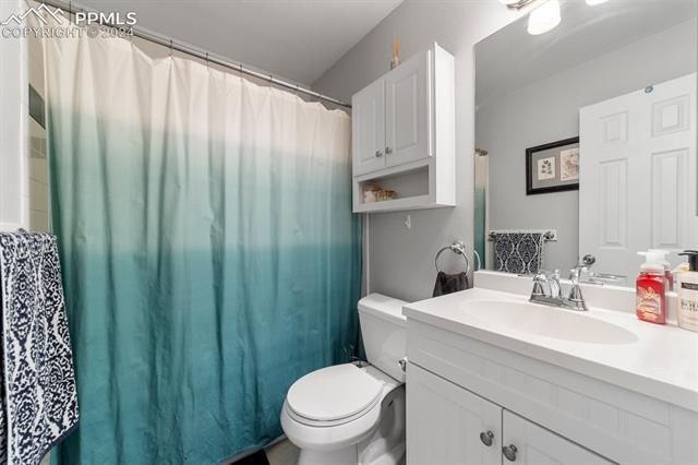 6525 Bismark Road Colorado Springs, CO 80922 - Photo 23 of 38 Bathroom featuring oversized vanity and toilet