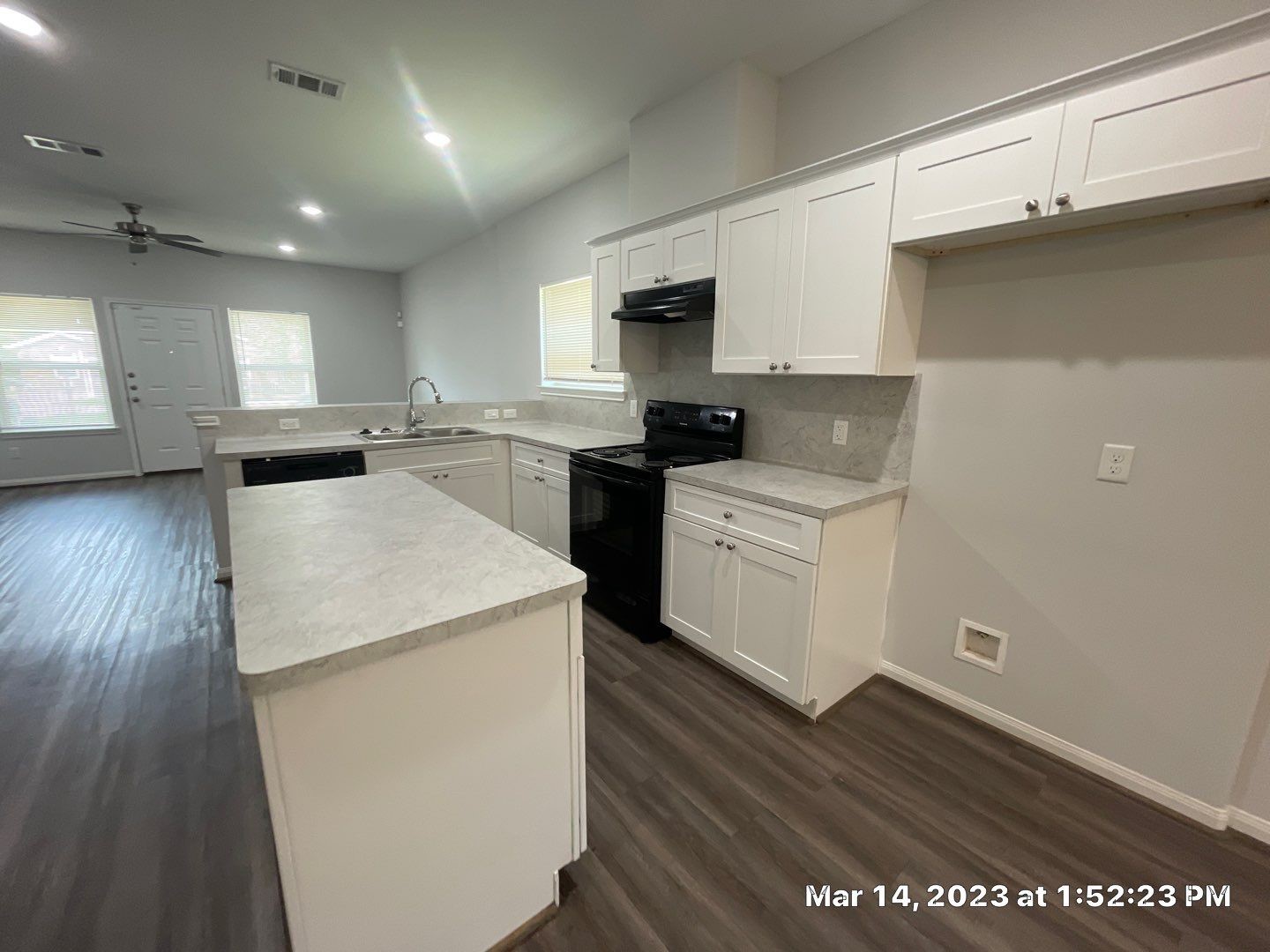 9014 Everglade Drive, Unit B Houston, TX 77078 - Photo 12 of 22 a kitchen with a sink a stove and cabinets