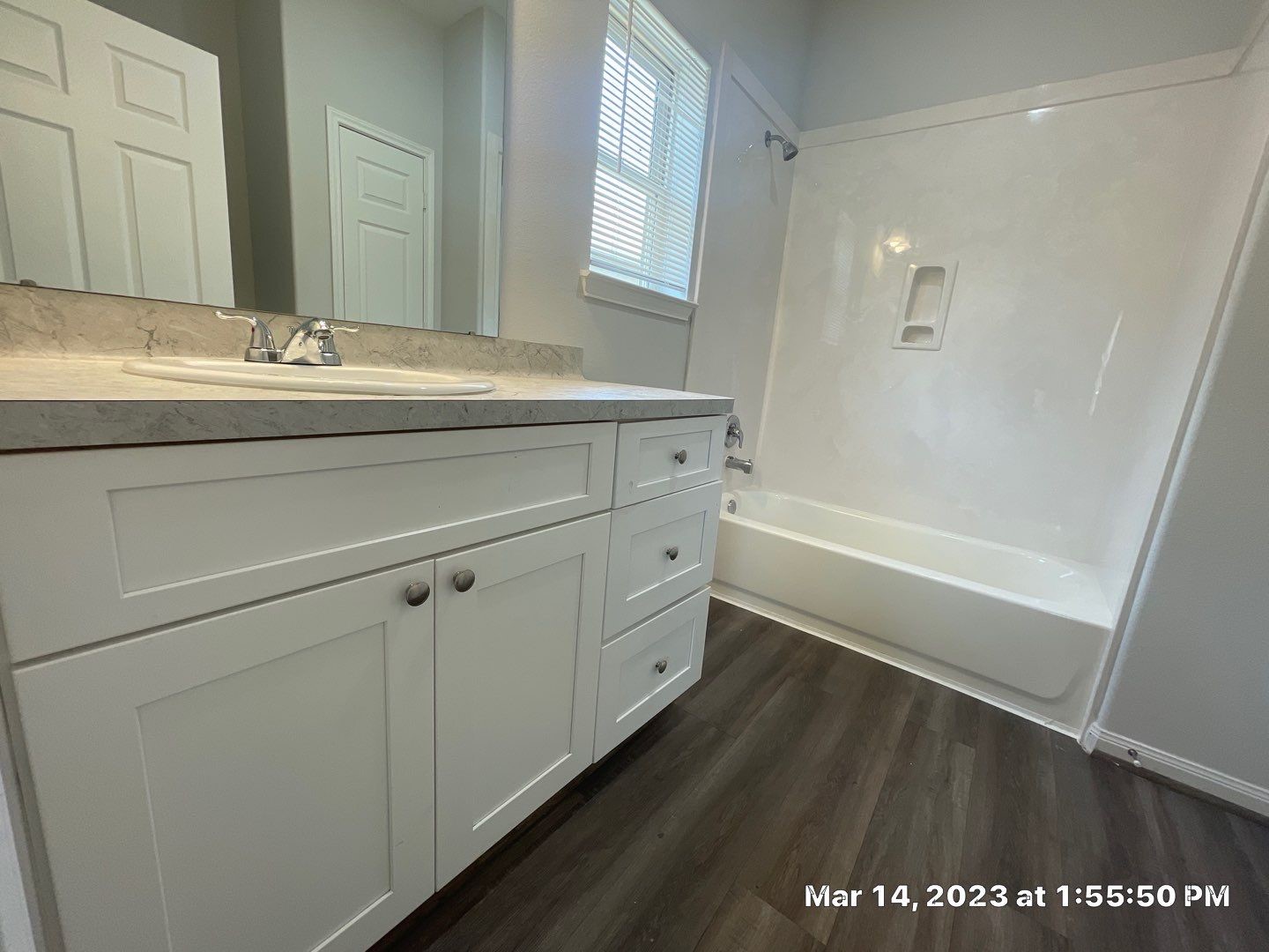 9014 Everglade Drive, Unit B Houston, TX 77078 - Photo 16 of 22 a bathroom with a sink a mirror and a bathtub