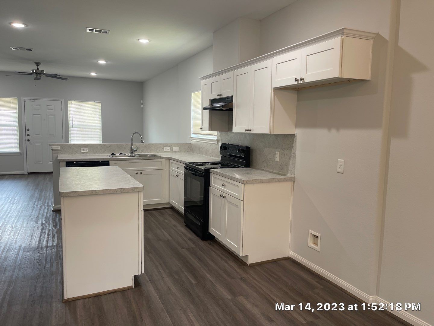 9014 Everglade Drive, Unit B Houston, TX 77078 - Photo 4 of 22 a kitchen with a sink a stove cabinets and wooden floor