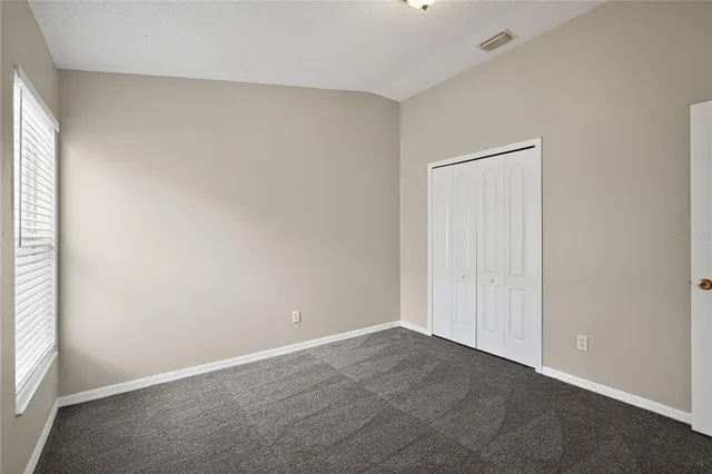 an empty room with a empty space and a window