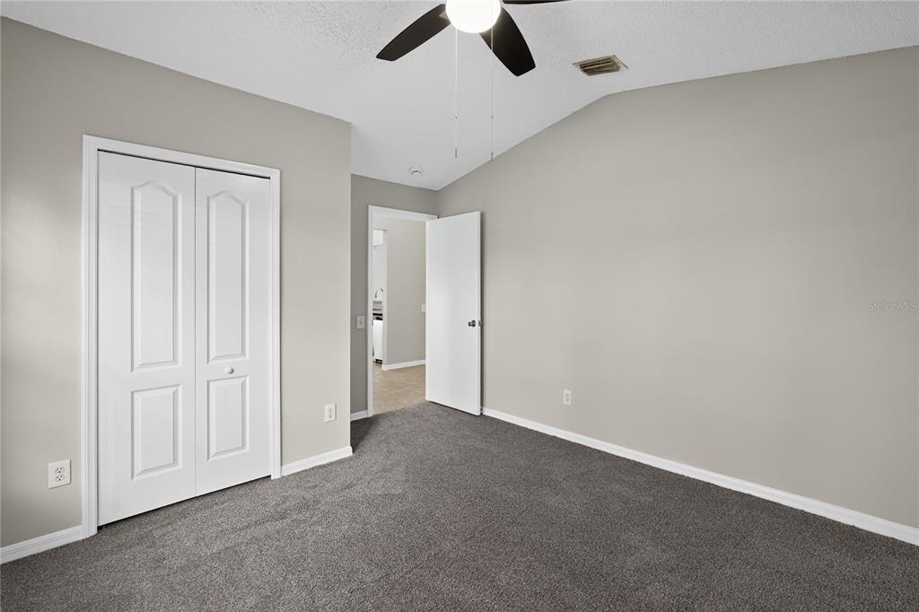 12630 Early Run Lane Riverview, FL 33578 - Photo 17 of 32 an empty room with view of ceiling fan