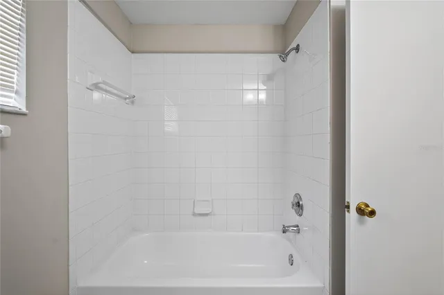 a close up of a bathtub curtain