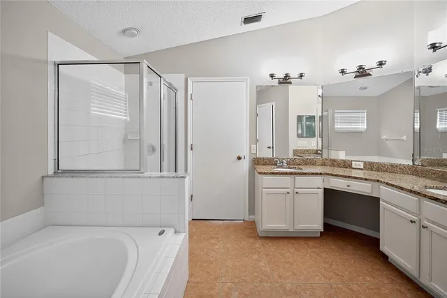 a bathroom with a granite countertop sink mirror and a