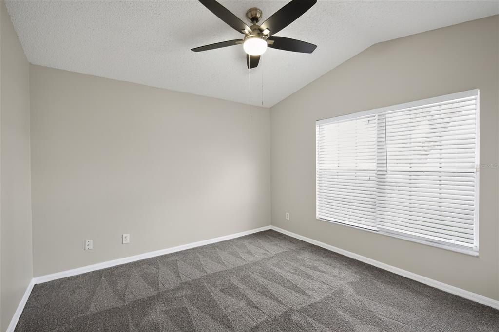 12630 Early Run Lane Riverview, FL 33578 - Photo 7 of 32 a view of an empty room with a window