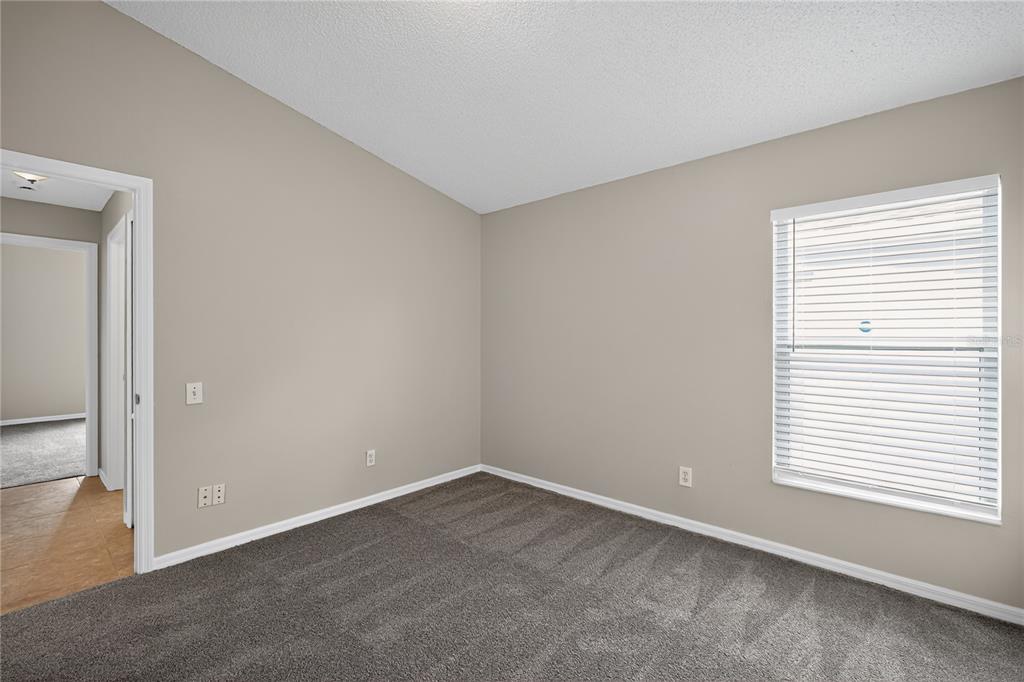 12630 Early Run Lane Riverview, FL 33578 - Photo 8 of 32 an empty room with a window