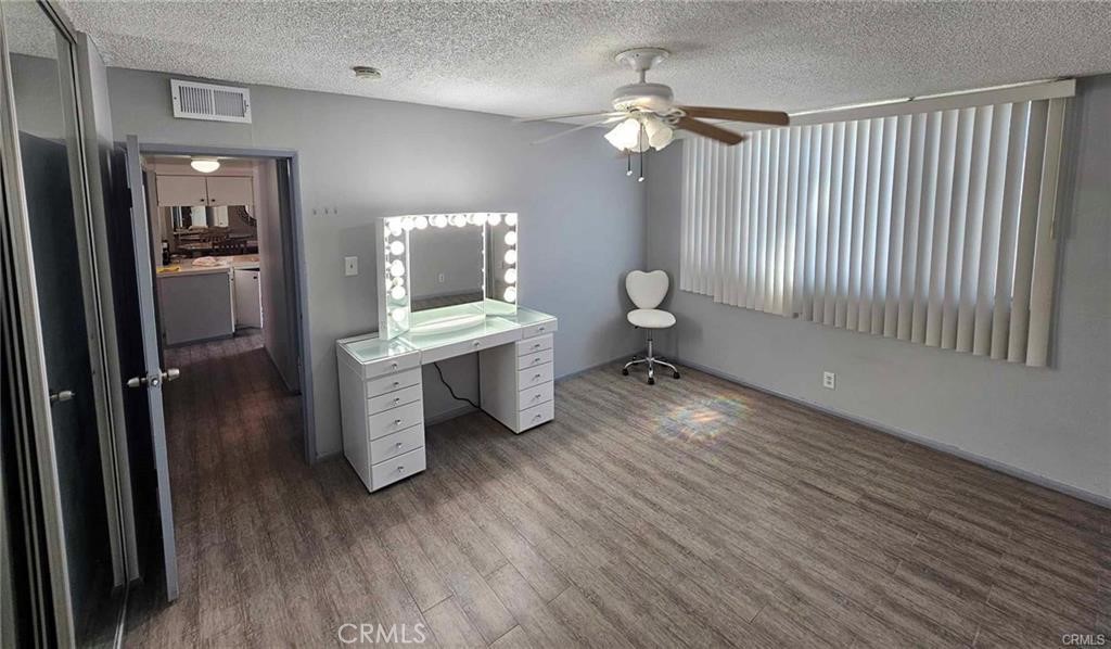 6979 Palm Court, Unit 126H Riverside, CA 92506 - Photo 15 of 25 a bathroom with a sink mirror and a toilet