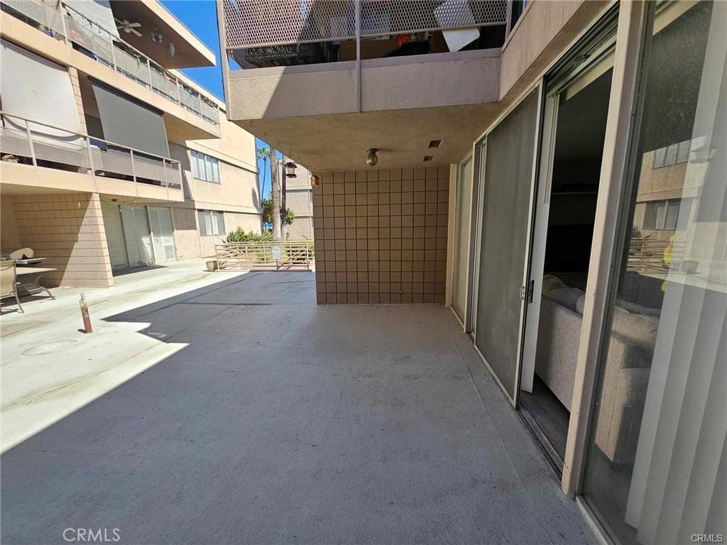 6979 Palm Court, Unit 126H Riverside, CA 92506 - Photo 19 of 25 a view of a pathway with a building