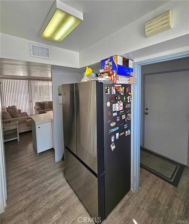 6979 Palm Court, Unit 126H Riverside, CA 92506 - Photo 9 of 25 a kitchen with stainless steel appliances granite countertop a refrigerator and a sink