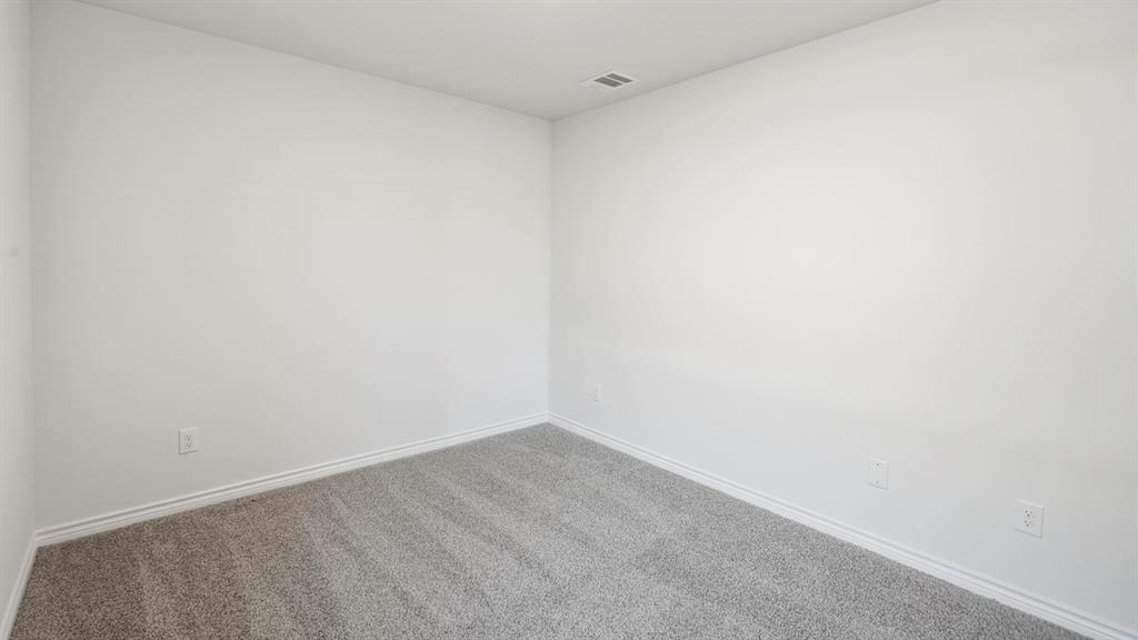 403 Flintlock Road Caddo Mills, TX 75135 - Photo 14 of 26 Carpeted empty room with baseboards