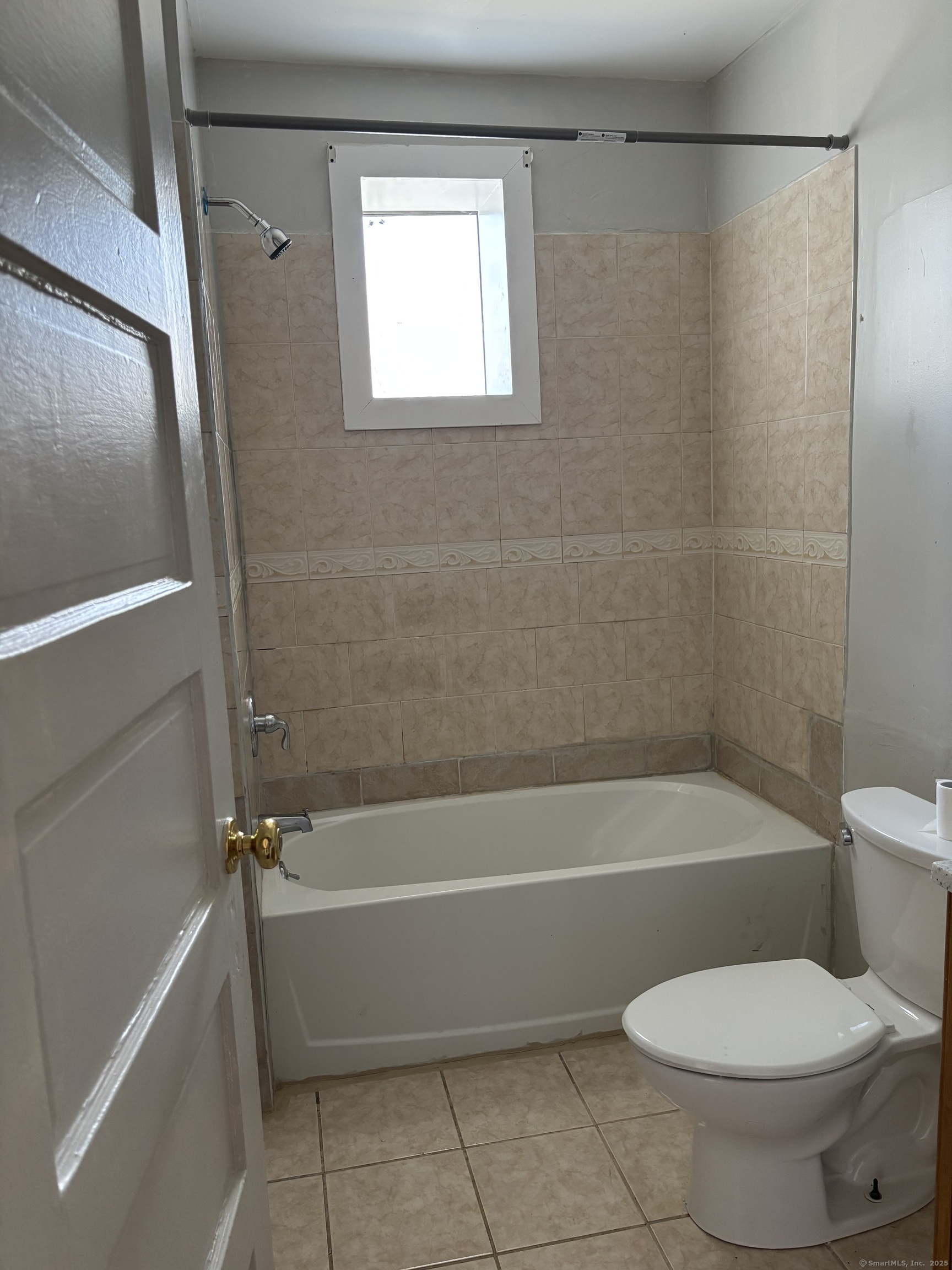 141 Pixlee Place Bridgeport, CT 06610 - Photo 7 of 7 a bathroom with a toilet and a bath tub