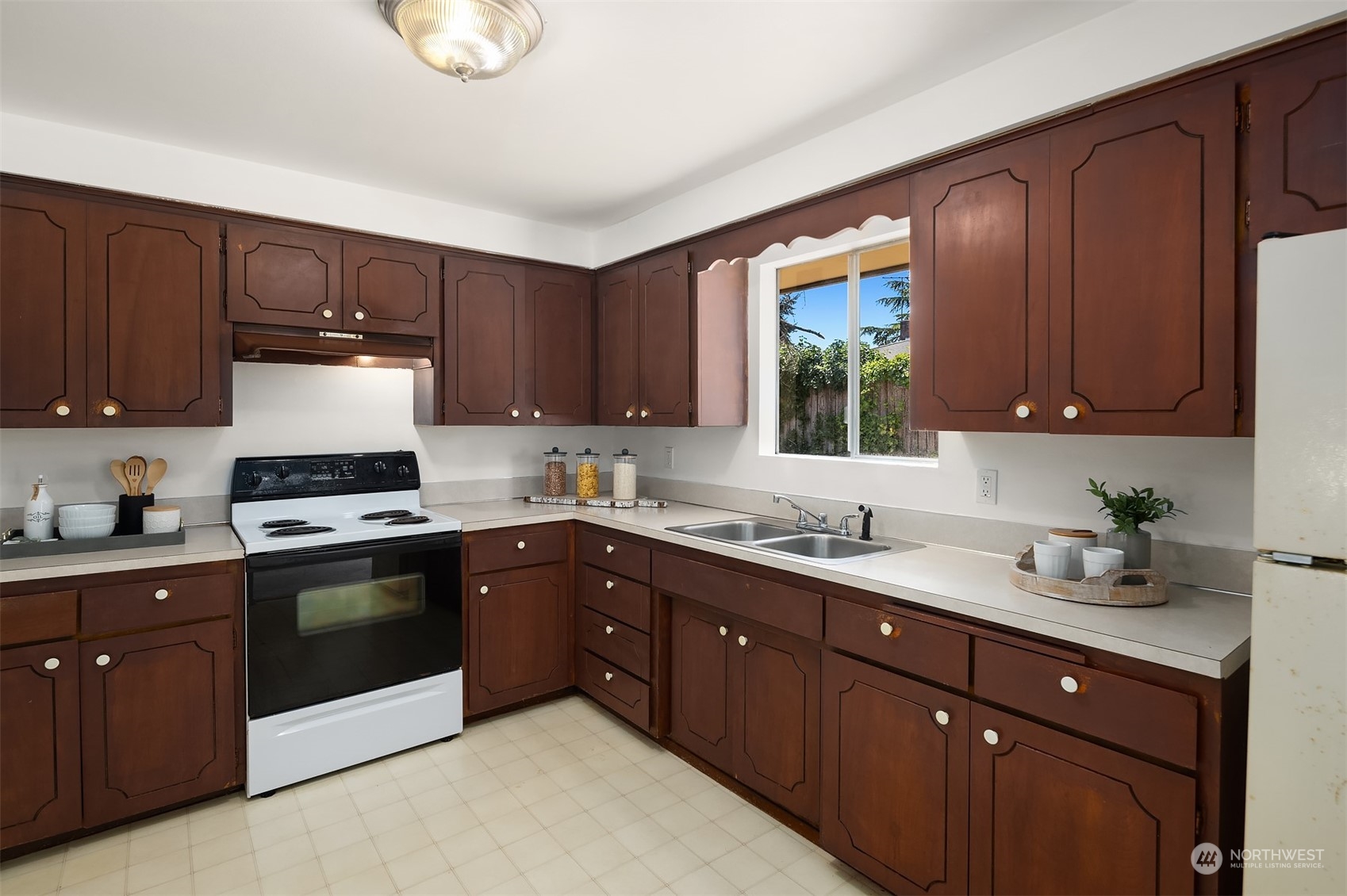 2525 Edmonds Avenue Northeast Renton, WA 98056 - Photo 9 of 17 a kitchen with a sink a stove and cabinets