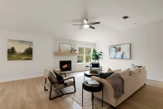 a living room with furniture and a fireplace