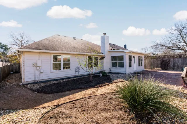 a front view of a house with a yard outdoor seating and barbeque oven