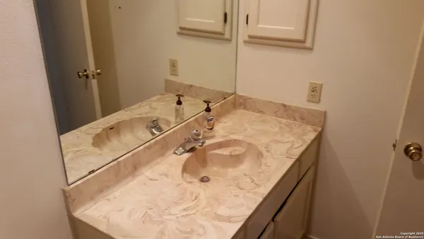 a bathroom with a tub and shower