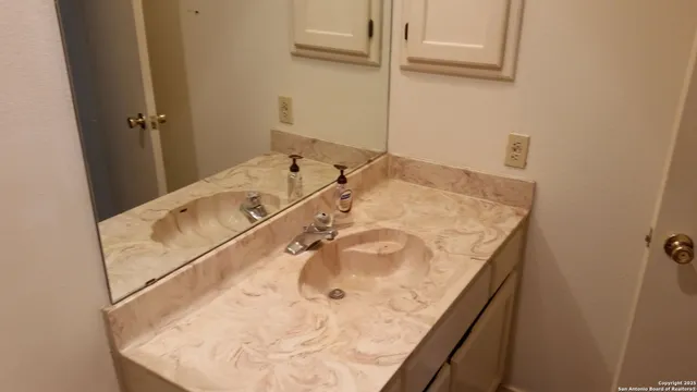 a bathroom with a tub and shower