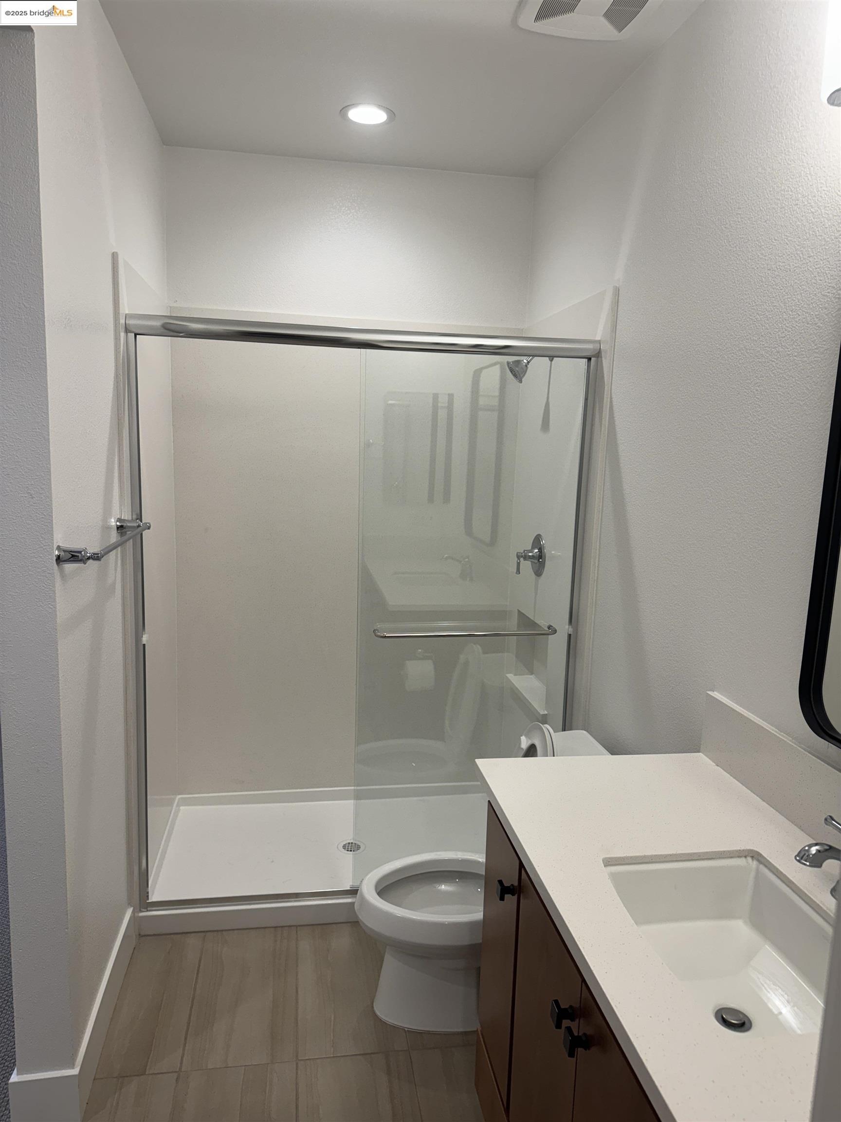 470 Trellis Way, Unit A Brentwood, CA 94513 - Photo 9 of 14 a bathroom with a sink toilet and shower