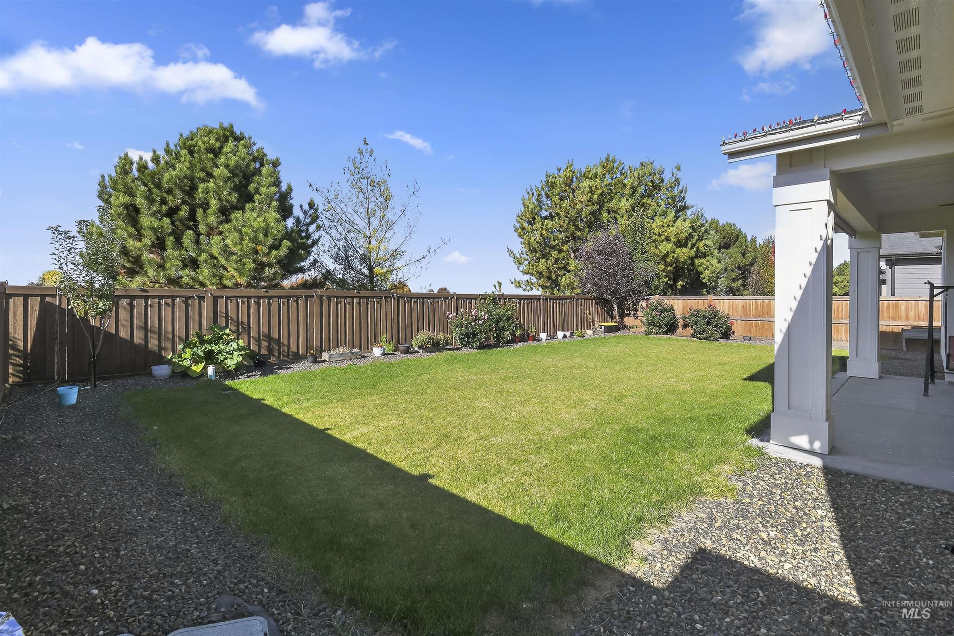 6839 North Willowside Avenue Meridian, ID 83646 - Photo 33 of 38 Fenced backyard with a patio